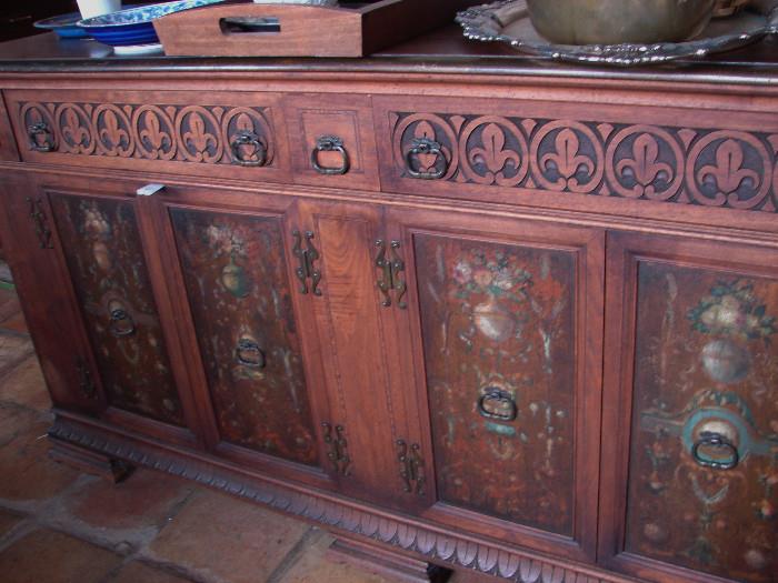 A sideboard with hand painted designs on door panels. Photos of more furniture to come.