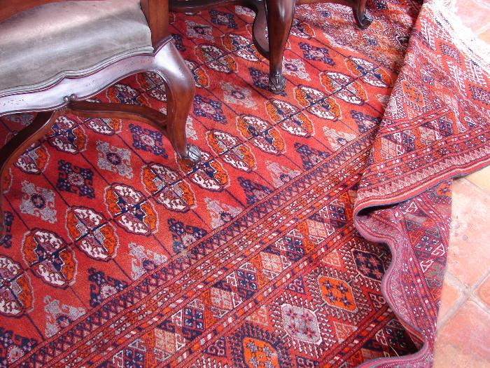 One of several room size Bokhara rugs in various hues of bittersweet to burgundy. There also are many, many smaller sizes of rugs in various weaves, ages, and colors.