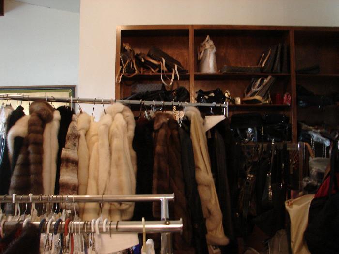 Furs range from fabulous designer furs to practical Examples: mink, chinchilla, sable, fox, and other. Size medium. Short, stroller, full length. Fabulous and in great condition. Designer handbags shown in background. From fab to faux but we will have them tagged for you.