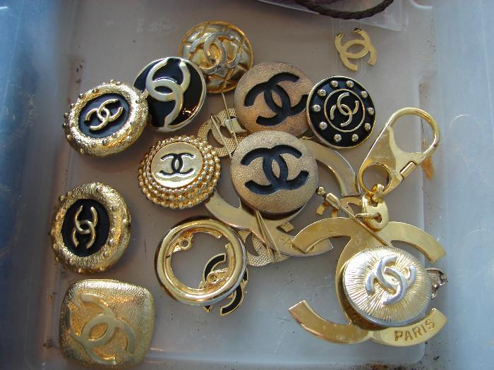 Some of the Chanel ear clips Holly is sorting to determine which are genuine and which are faux.