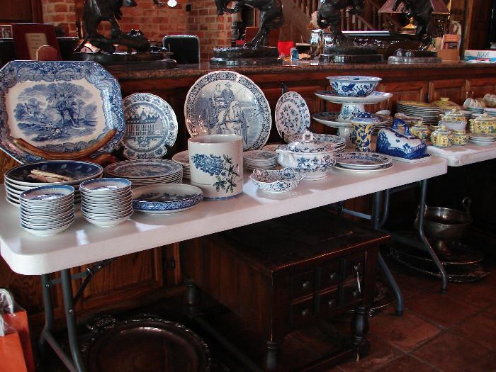 Various blue and white dinnerware and decorative plates.
