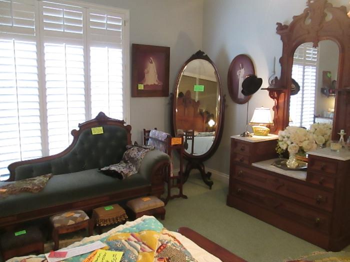 VICTORIAN BURLED WALNUT FAINTING COUCH, ANTIQUE FOOTSTOOL COLLECTION, PAIR OF MATCHING ANTIQUE QUILT RACKS, MAHOGANY ANTIQUE CHEVAL MIRROR, QUILTS, EASTLAKE BURLED WALNUT WITH MARBLE TOP DRESSER, 1950'S CHARTREUSE LAMPS, PLATEAU MIRROR, ANTIQUE FRAMES, VINTAGE THROWS AND FABRIC.