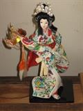 folk art Japanese geisha doll with samurai warrior helmet