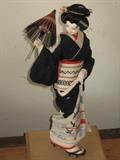 folk art Japanese geisha doll in ceremonial clothes