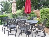 Several wrought iron sets purchased from Lynn's Patio and found around the pool area...