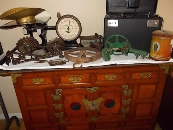 Oriental style cabinet, Old scale, antique apple peeler, and other antiques.