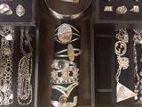  Sterling silver estate jewelry including earrings, rings, pins, pendants and necklaces, at 50% off our already reasonable prices. Styles include Mexican and Native American designs. In addition, fabulous statement costume jewelry (with vintage pieces mixed in) also 50% off. Necklaces, bracelets, earrings, pins and rings galore. 