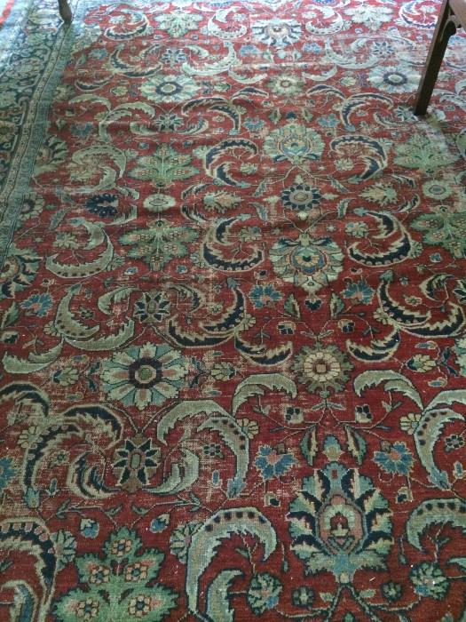    Large, very old rug in red, black, blue, & green