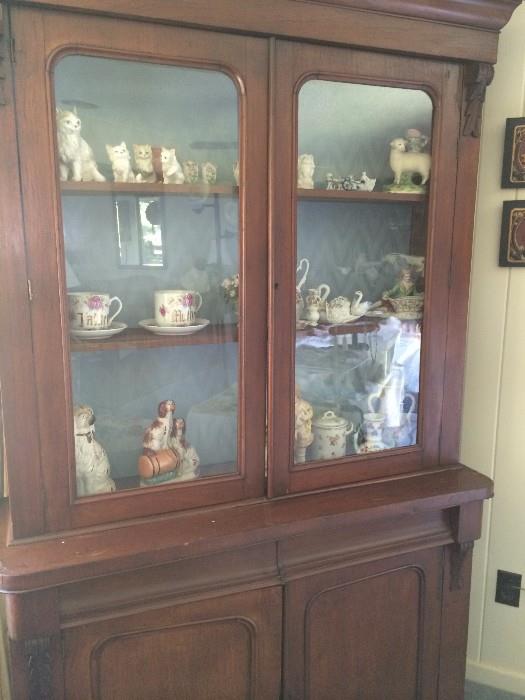     Two-door glass front antique display cabinet