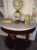 Antique demi-lune table with marble top; enamel box; Gone With the Wind lamp; satin glass pitcher; 