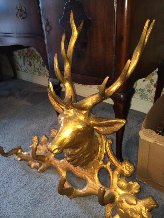        Gold- colored deer hat rack