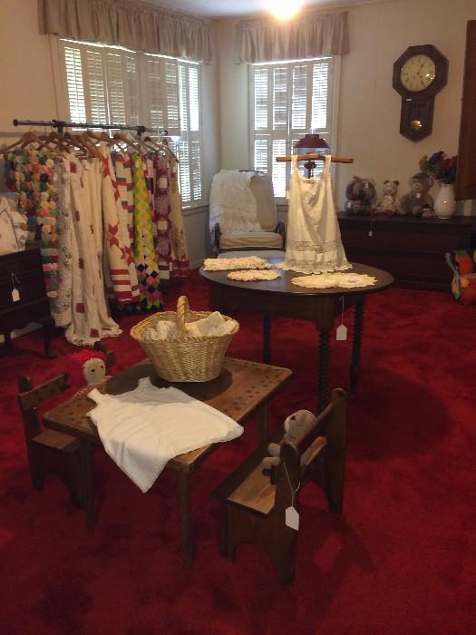 Child's table & chairs; many vintage quilts; round table; vintage clothing on antique display rack