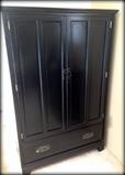 Wonderful black tall double door cabinet!