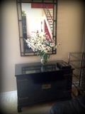 Great wall mirror and black two door cabinet that coordinates well with any decor!
