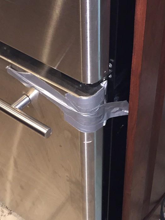 STAINLESS STEEL REFRIGERATOR ( BROKEN OFF BOTTOM SLIDING DOOR)