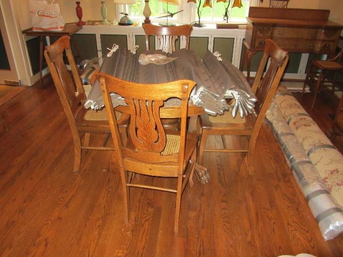 Oak table shown with set of oak chairs ( sold separately)
