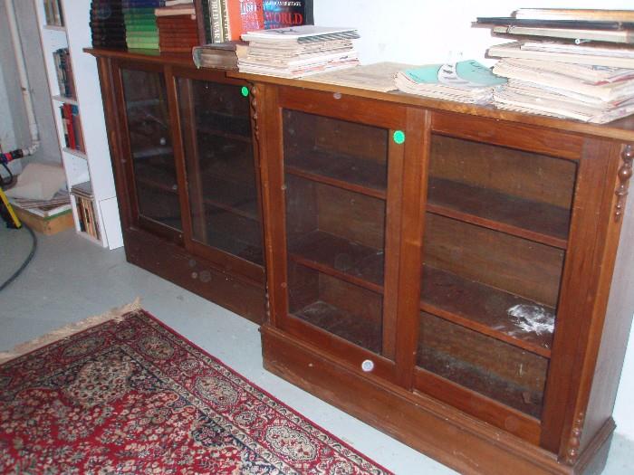 Pair ( but sold separately) of walnut barrister book cases with sliding glass doors