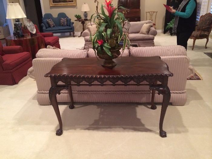 Classic sofa/library table; matching formal sofas; matching red club chairs