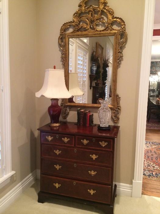   Five drawer chest and gold decorative mirror