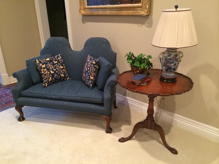   Rare double hump back Chippendale settee; pie crust side table; some of the many lamps and decorative accessories