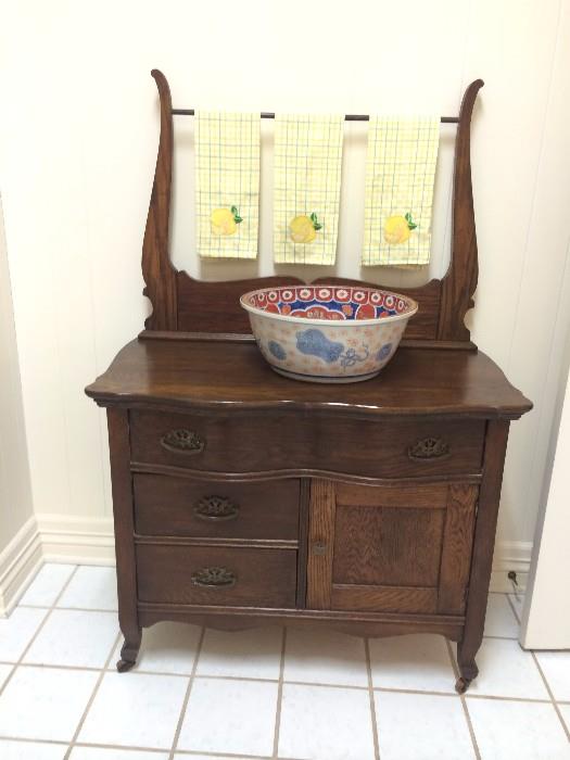           One of two antique washstands