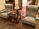 Extra comfortable striped recliners; side table; rugs