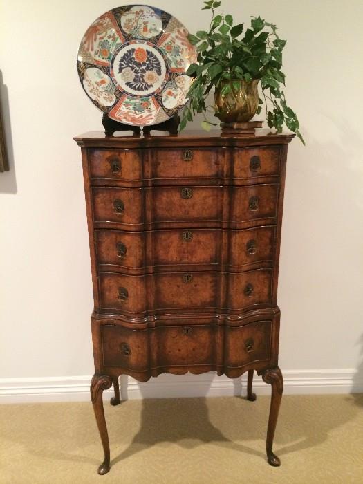        Elaborate 5-drawer burled wood chest