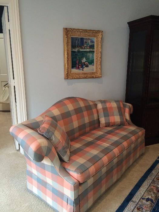     This plaid love seat has matching chair.