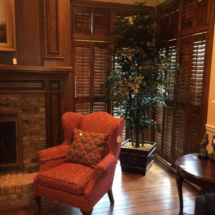 Fireside chair; large artificial plant