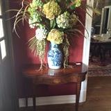 Blue & white porcelain vase with hydrangea floral arrangement