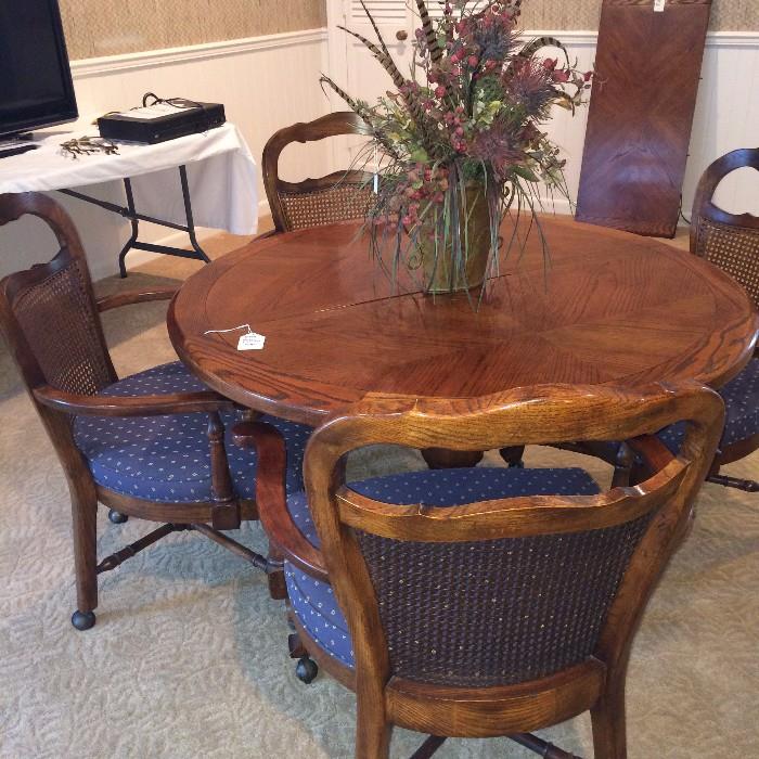    Great game table with four chairs on casters