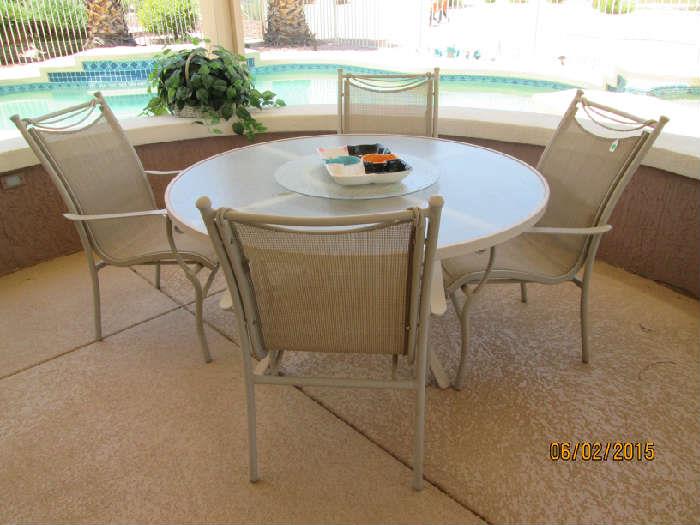 Table with lazy Susan and comfy chairs