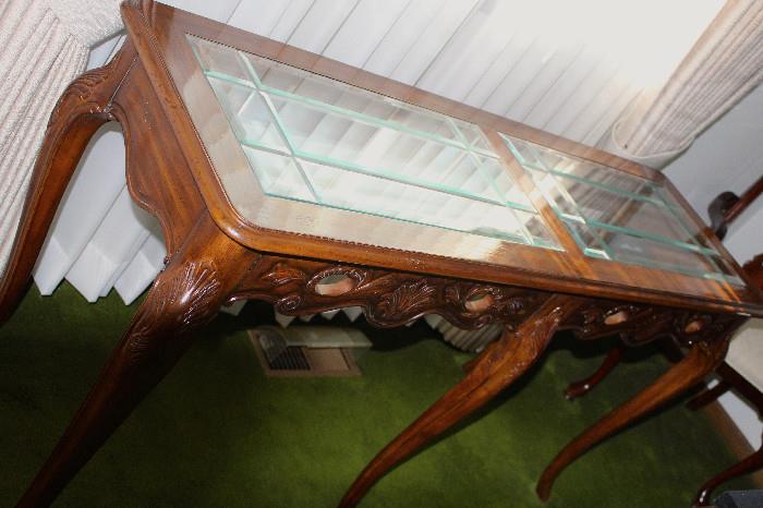 Parlor table with sweet beveled glass top