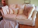 Comfy sofa.  Please note:  Sofa is beige!  Not sure why the pink cast to the color....