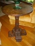 Nicely carved table with burl wood top and angel carvings on two of the base feet