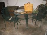 Metal patio set with 2 chairs.  The table is in two sections and can be used separately