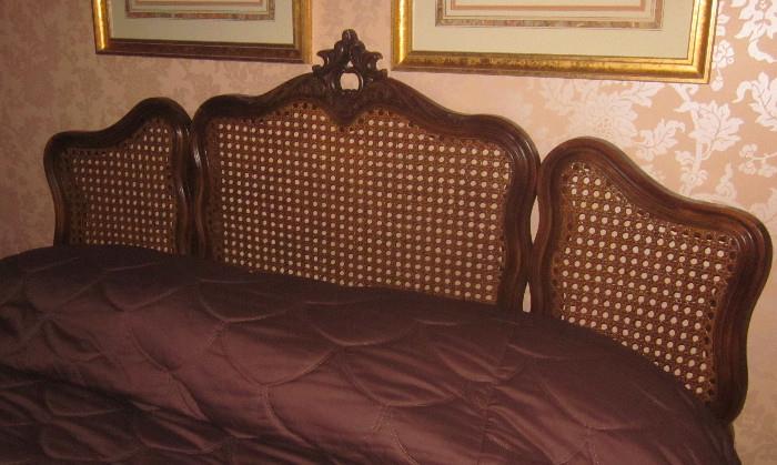 French, cane headboard. The bed is queen-sized and includes the metal bed frame.