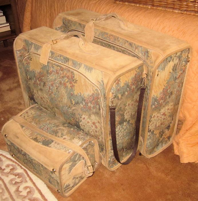 Three-piece American Tourister luggage.