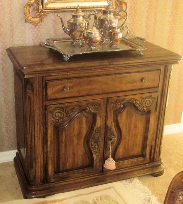 Elegant, Country French carved server, made by National, Mt. Airy. Two top pieces slide apart to reveal a black, heat-resistant, water-resistant surface for serving.