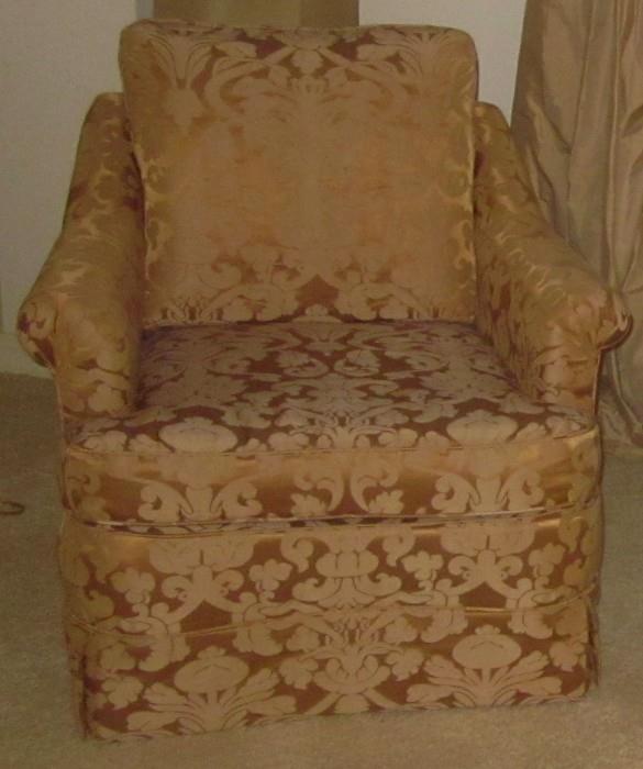 One of two matching upholstered chairs in a brocade fabric. One chair appears lighter in photos, but both are identical.