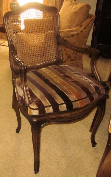 Beautiful cane back French chair with plush, velvet and silk striped, fitted cushion.