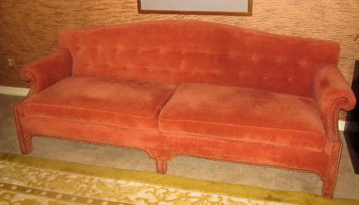 Chinese Chippendale, camel back sofa. Attractive tangerine velour fabric. Much more attractive than the photo appears. Maker is unknown.