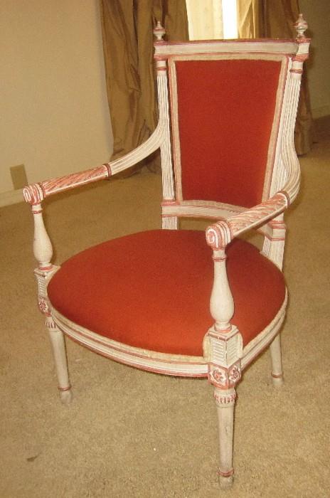 Stately, French open arm chair; Heavily carved.
