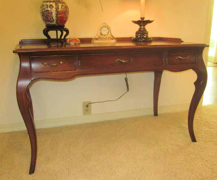 French three-drawer writing table; Made by Hekman.