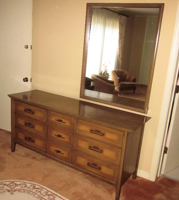 Walnut, oriental-style, nine-drawer dresser and mirror.