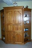 Entertainment armoire with bookcase on each side.