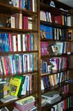Tall bookcases with adjustable shelves--full of books--cooking, gardening, birdwatching, children's books, many on Theology and Christian themes.