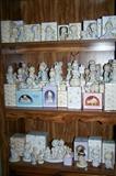 Dozens of Precious Moments figurines--many with boxes.