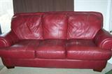 Contemporary red leather chair and sofa set.