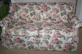 Floral loveseat sofa/bed--opens to twin side bed. Nice innerspring mattress, good condition.